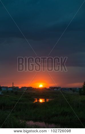 Sunset over calm lake