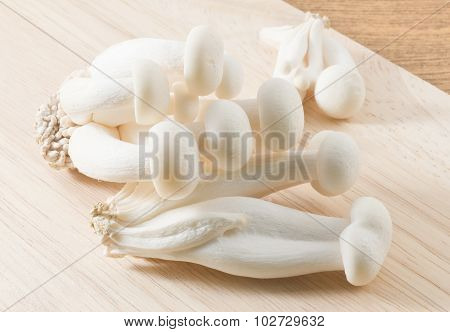 White Shimeji Mushroom On A Wooden Cutting Board