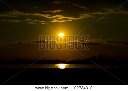 Sunset over calm lake