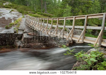 Bridge over waterfall