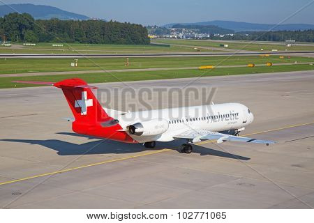 ZURICH - JULY 18: Helvetic airways taxiing in Zurich after short haul flight on July 18, 2015 in Zurich, Switzerland. Zurich airport is home for Swiss Air and one of biggest european hubs.