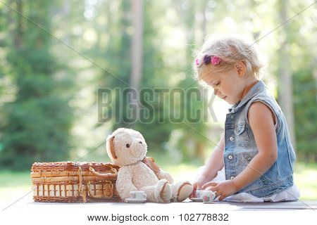 Young Girl Playing With Teddybear