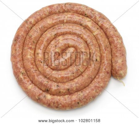 raw cumberland sausage, spiral pork sausage isolated on white background