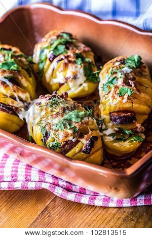 Potato.Roasts potatoes. Home cooking roasts potatoes. Baking pan full of baked potatoes stuffed with