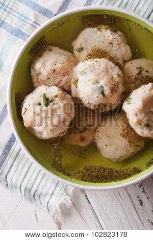 Canederli In A Broth Close Up In A Bowl. Vertical Top View
