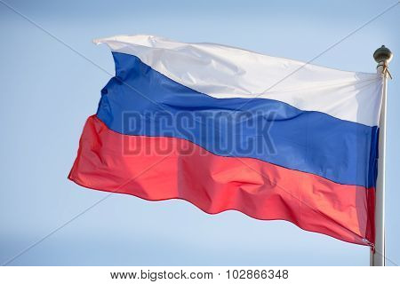 Official Russian Flag On The Blue Sky Background