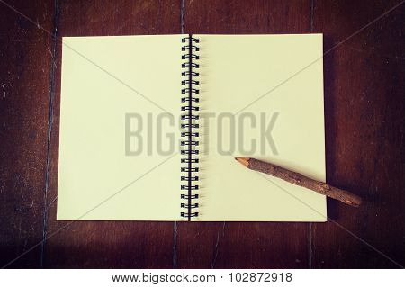 Wooden Pencil On Notebook