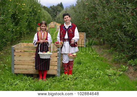 Resen, Macedonia. September, 27  2015- Boy And Girl In Traditional Clothes Posing With Apples During