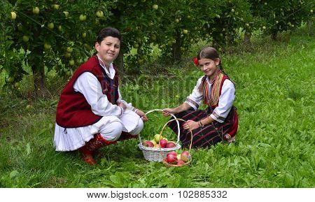 Resen, Macedonia. September, 27  2015- Boy And Girl In Traditional Clothes Posing With Apples During