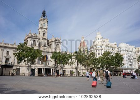 VALENCIA, SPAIN - SEPTEMBER 26, 2015: Tourist in the Ayuntamiento (City Hall) Plaza of Valencia. Valencia is the capital of the autonomous community of Valencia and the third largest city in Spain.
