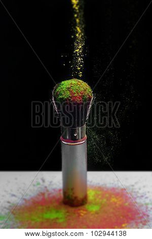 Makeup brush with holi paint