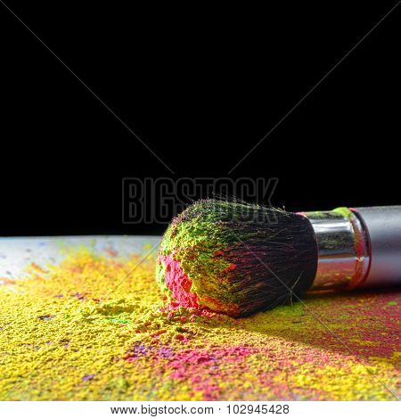 Makeup brush with holi paint