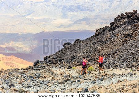 Unidentified people runs from the top of El Teide Volcano Tenerife Spain