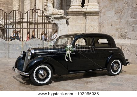 VALENCIA, SPAIN - SEPTEMBER 26, 2015: A Mercedes-Benz 170S parked in front of the Valencia Cathedral. The Mercedes-Benz 170S was a luxury four cylinder passenger car manufactured between 1949-1952.