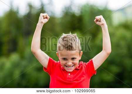 Happy Boy With Raised Arms