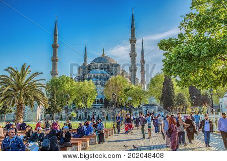 ISTANBUL, TURKEY - MAY 2, 2017: View of Sultanahmed square, Blue Mosque and walking people in spring time in Istanbul, Turkey