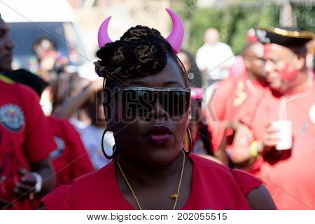 London United Kingdom - August 27 2017. Notting Hill Carnival one of the largest street parties in Europe is now in its 51st year. This year was close to the ruin of Grenfell Tower scene of a devastaing fire.