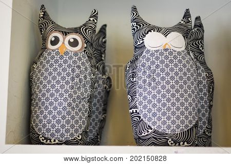 Owl stuffed dolls crafted by hand, one sleeps and one is awake