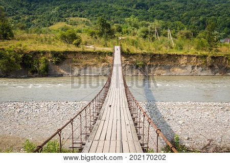 Suspension Cable Bridge, Crossing The River. Adygea Republic, Krasnodar Region, Russia