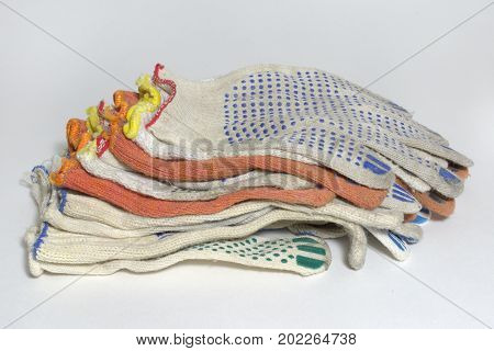 Pile Of Protective Cotton Anti-slip Gloves For Industrial Workers And Home Gardening