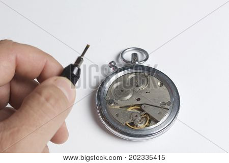 The Watch Workshop. Repair Of Old Watches. The Mechanism Of The Clock, The Screwdriver, Which The Ma