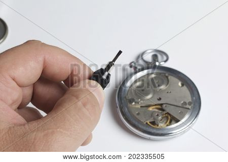 The Watch Workshop. Repair Of Old Watches. The Mechanism Of The Clock, The Screwdriver, Which The Ma