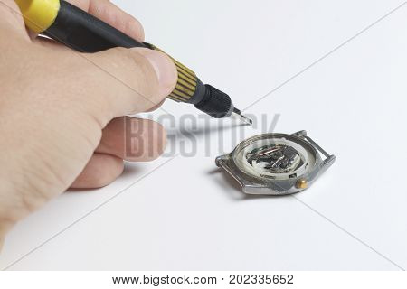 The Watch Workshop. Repair Of Old Watches. The Mechanism Of The Clock, The Screwdriver, Which The Ma