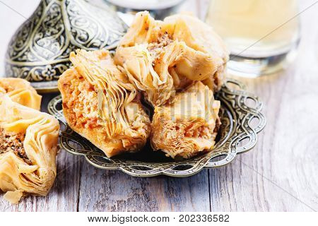 Traditional arabic sweet dessert Baklava on wooden table