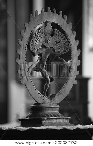A view of an antique Natraj god sculpture from the rear view.