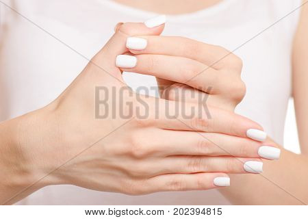 Female hand hurts a finger fracture of a dislocation on a white background isolation