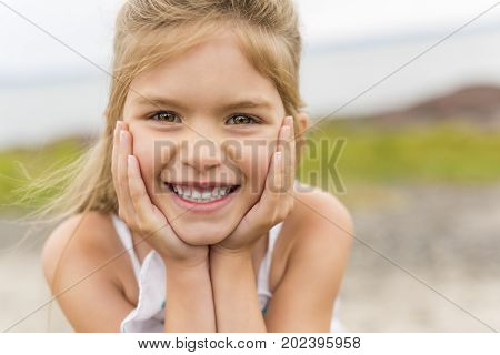 A Little girl outdoors at the beach
