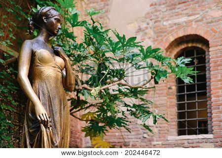 VERONA ITALY - MAY 2017: Patio and statue Juliet Verona Italy. Very popular tourist place.
