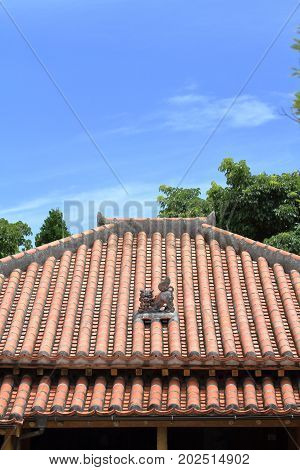 Shisa (guardian From Kingdom Of Ryukyu) On The Roof In Okinawa, Japan