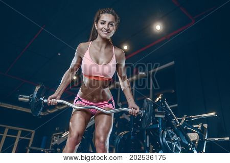 Sexy Athletic Young Girl Training Back In Gym