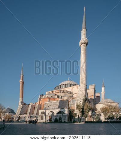 ISTANBUL TURKEY - NOVEMBER 18 2013: People visiting the historical area of Sultanahmet Istanbul. The famous landmark Hagia Sophia