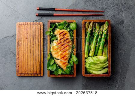 Healthy Lunch In Wooden Japanese Bento Box. Balanced Healthy Food Grilled Chucken And Avocado With A
