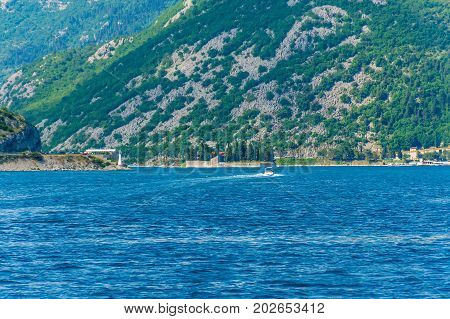 The Yacht Sails Near The Picturesque Island Of St. George In The Bay Of Kotor.