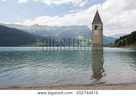Submerged Tower Of Reschensee Church Deep In Resias Lake In Trentino-alto Valley