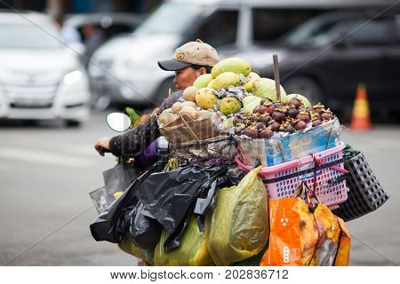 HO CHI MINH CITY (SAIGON), VIETNAM - JULY 2017 : People carrying on with their lves in Saigon, Ho Chi Minh City, Vietnam