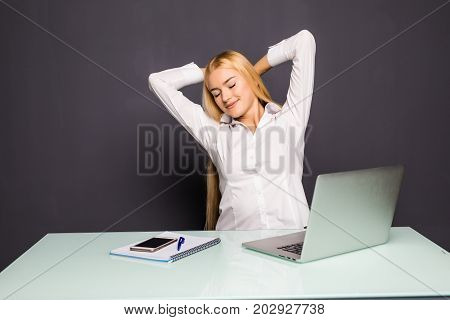 Young Businesswoman Is Relaxing In Her Office. She Is Stretching Her Body At Office.