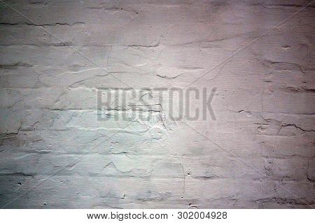 Old Brick Wall, Once Upon A Time Plastered And Whitewashed. Ancient Wall. Abstract Background.