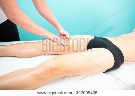 A Masseur And Physiotherapist Quadriceps Massage To An Athlete