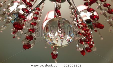 Retro Style Glass Crystal Chandelier Hanged From Ceiling. Reflective Surface Of Crystal Ball Closeup