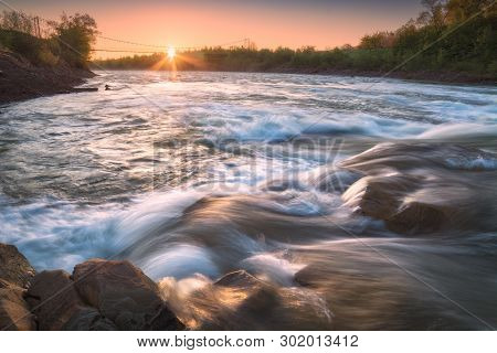 Majestic Sunrise On A Fast Mountain River Prut In Ukrainian Carpathians. Beautiful Countryside Lands