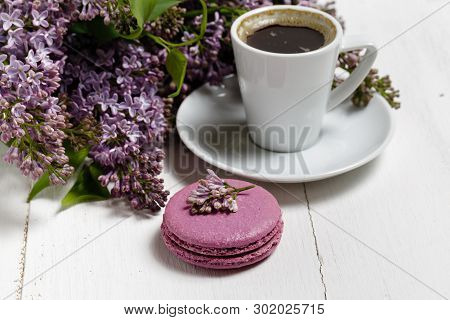 Little Delicate Elegant Bouquet Of Spring Flowers And A Teacup On White Wooden Table, Morning Breakf