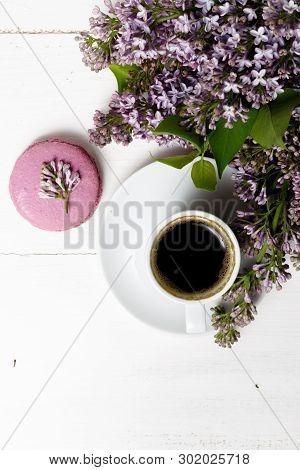 Little Delicate Elegant Bouquet Of Spring Flowers And A Teacup On White Wooden Table, Morning Breakf