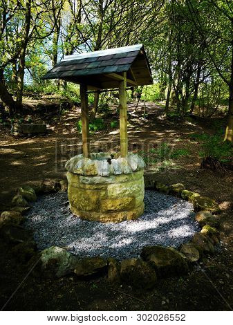 A View Of An Ornamental Wishing Well In An Area Of Woodland In The Fife Village Of Crossgates