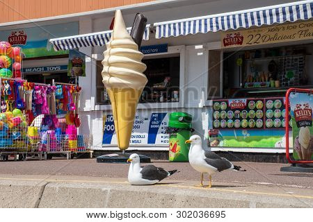 Clacton  Essex United Kingdom  -10 May 2019: Large Plastic Icecream In Front Of Shop With Seagulls S