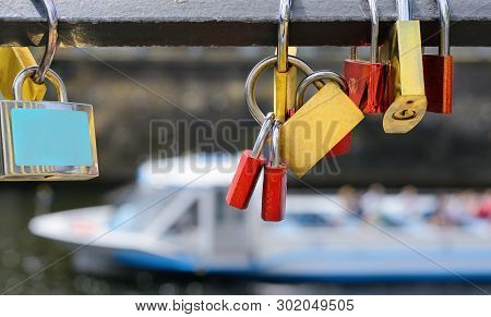 Locks On Historical Bridge Over Water With Passenger Ship As A Backgrop, Spree River In Central Berl