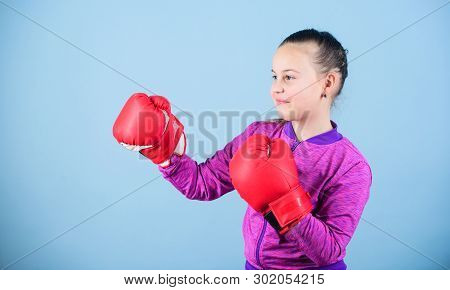 Contrary To Stereotype. Boxer Child In Boxing Gloves. Confident Teen. Enjoyment From Sport. Female B